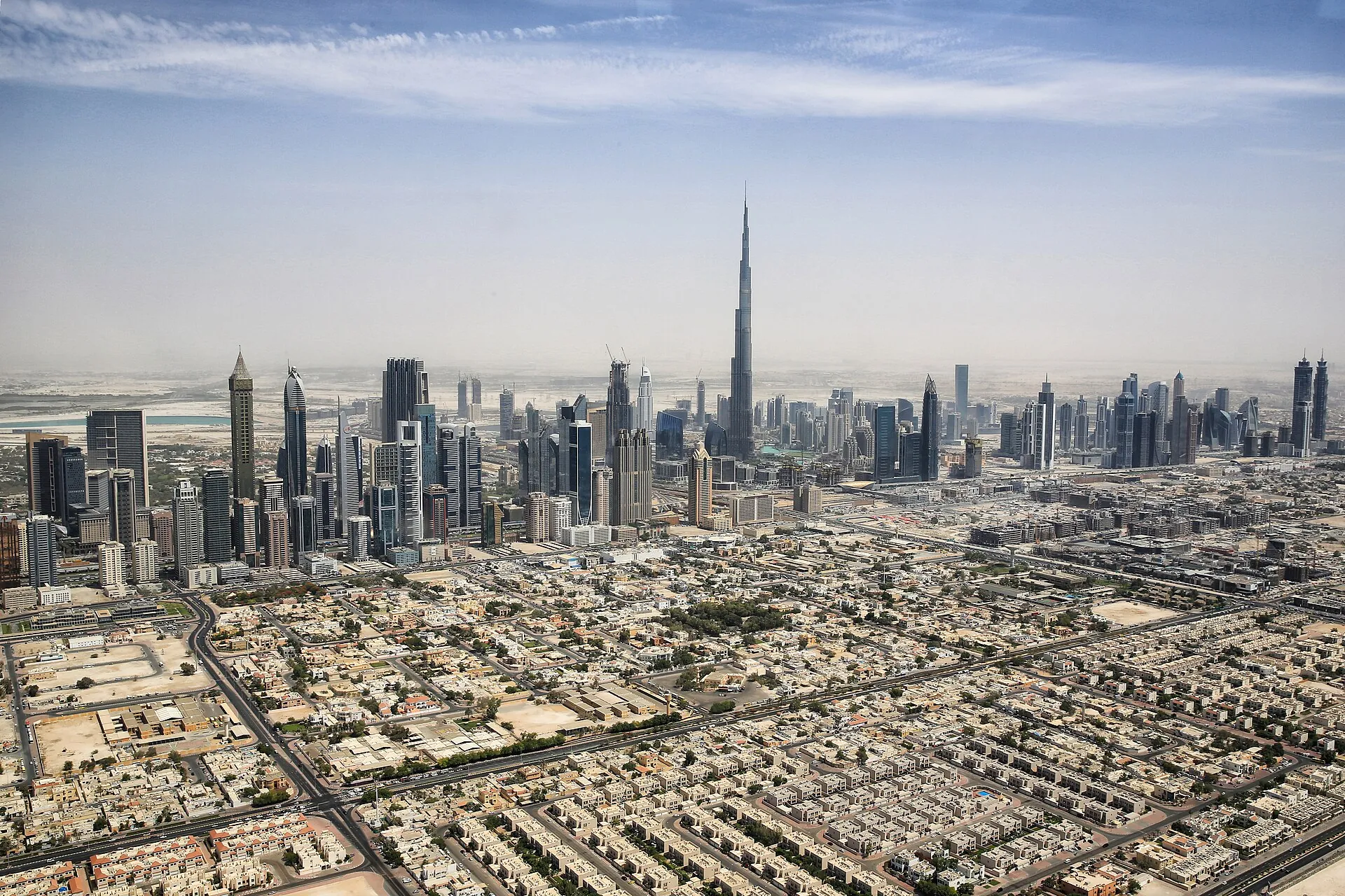 Aerial view of the Dubai skyline with the Burj Khalifa rising above the city