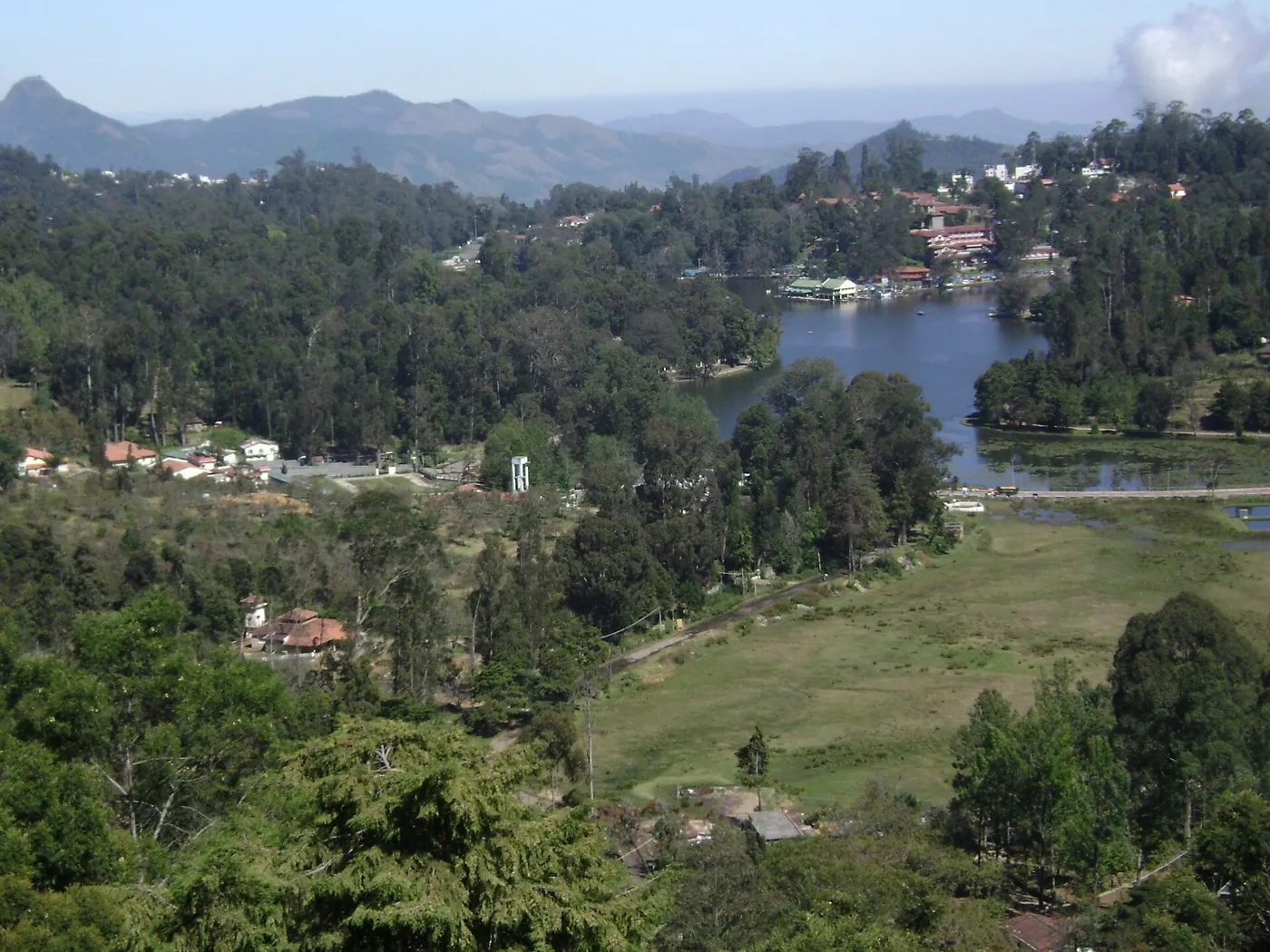 Kodaikanal Lake seen from the hills, with the town and forest around it