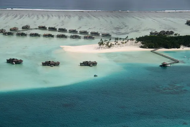 Aerial view of an island resort and lagoon in the Maldives