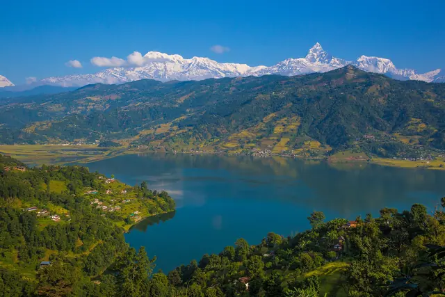 Phewa Lake in Pokhara with the snow-capped Annapurna range behind