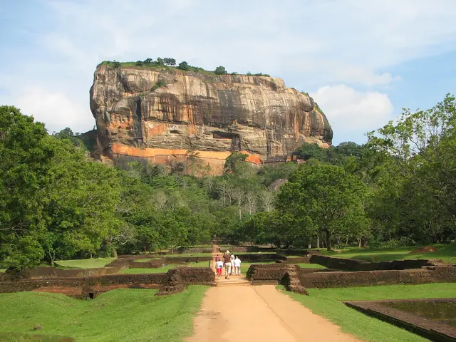 Sigiriya rock fortress rising above the gardens and forest