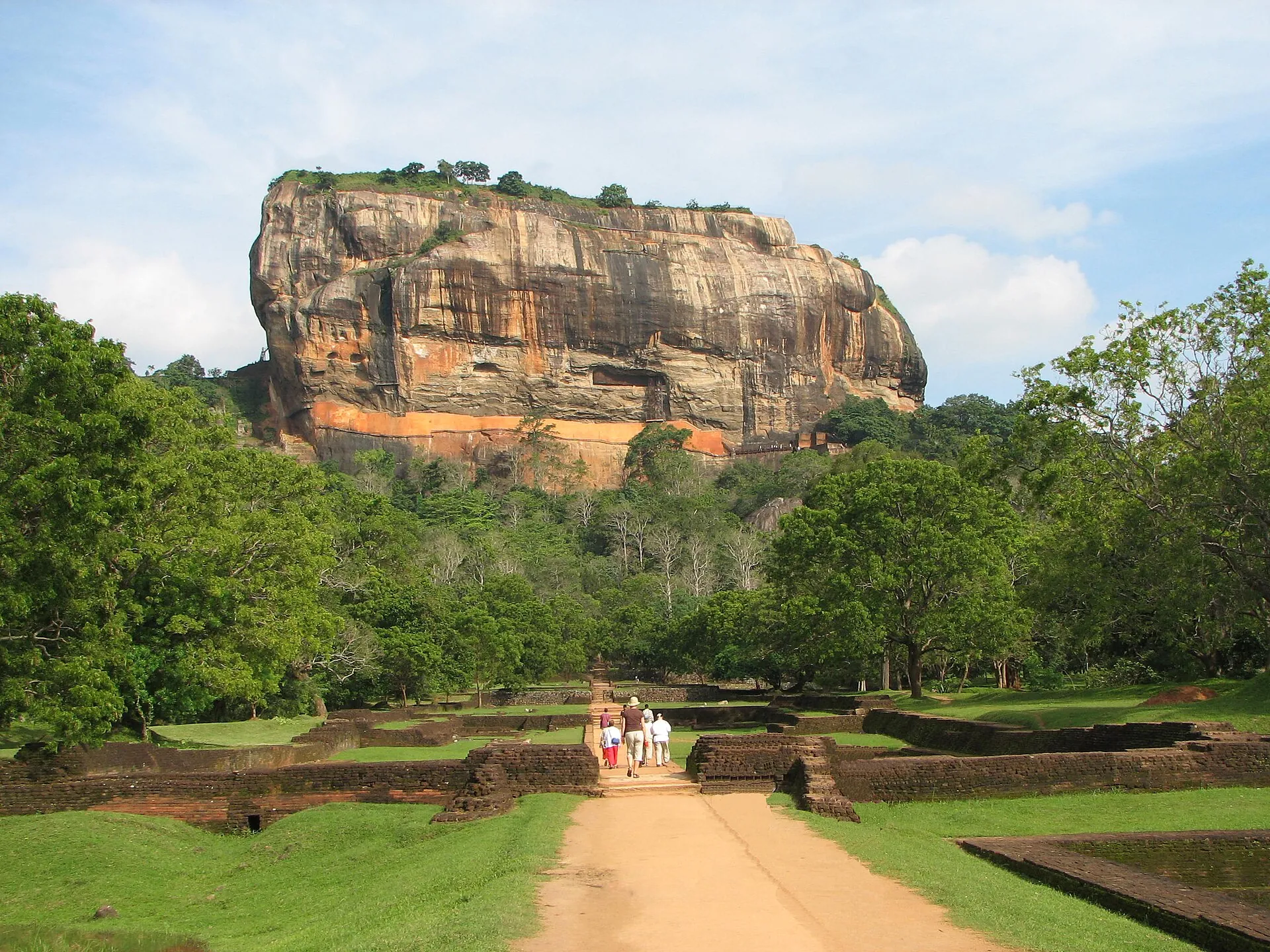 Sigiriya rock fortress rising above the gardens and forest