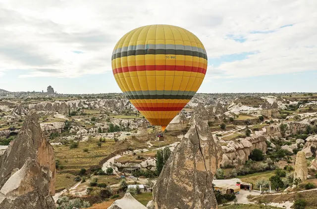 A hot air balloon floating over the valleys of Cappadocia