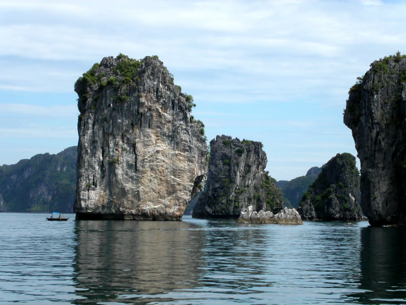 Limestone islands rising from the water in Ha Long Bay